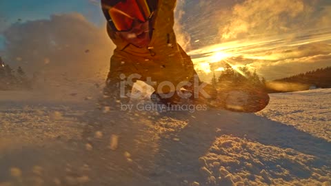 Time warp of a snowboarder carving down the slope stock video