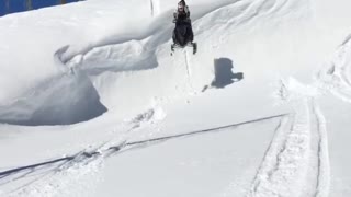 Snowmobile ledge faceplant snow