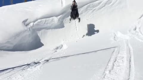 Snowmobile ledge faceplant snow