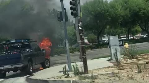 Man Not Worried as He Walks Past Raging Car Fire