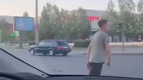 Guy Playing In Traffic