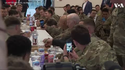 Biden Eats Pizza With US Troops in Poland