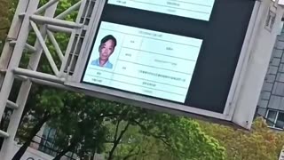 China citizens, on the blacklist of Social Credit System, displays their faces on billboards