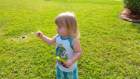 Toddler hilariously fails at blowing bubbles