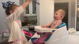 Baby Girl Ecstatic While Being Fed By Big Sister