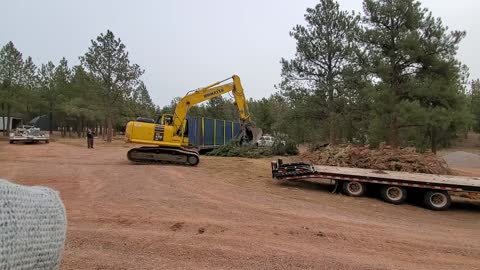 Moving the trees out of the way to unload the 2nd conex