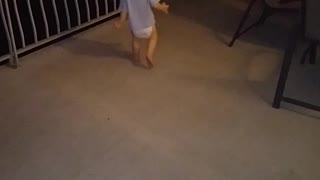 Baby playing in the wind