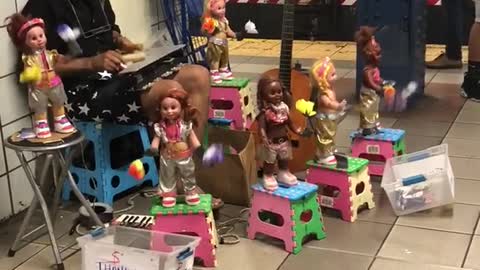 Man plays xylophone with toys around