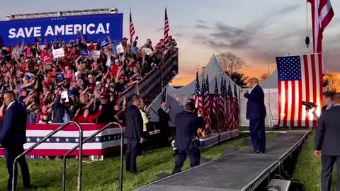 Trump danced in front of the audience against the backdrop of a sunset