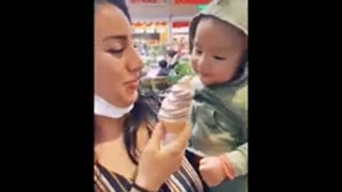 Baby thinks eating ice cream