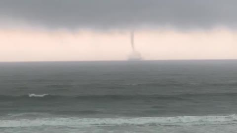 Friends Watching a Waterspout