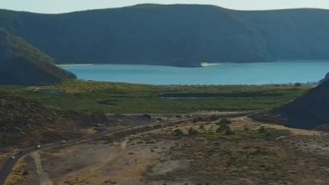 Landscape with mountains and a lake, seen from above