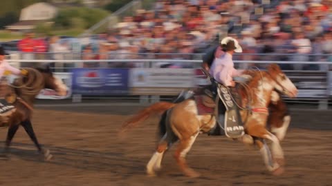 Editorial Cowboy rides bareback in PRCA rodeo event