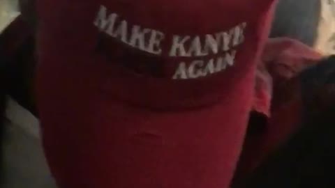 Make kanye black again red hat on subway