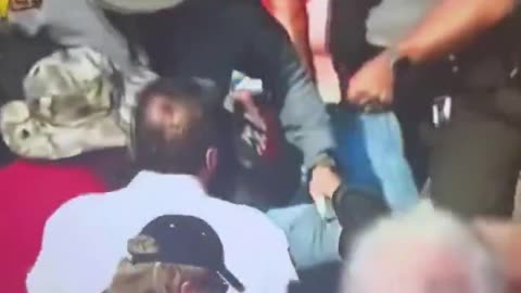 Man being dragged out after Trump shooting
