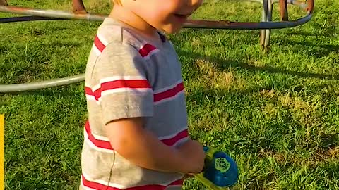 Little Boy Catches Fish With Toy Rod