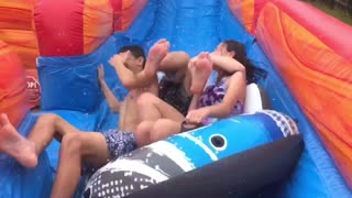 Mom Gets Knocked On The Ground Trying To Video The Kids Going Down The Slide