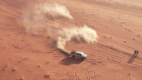 Pickup truck playing drift on desert