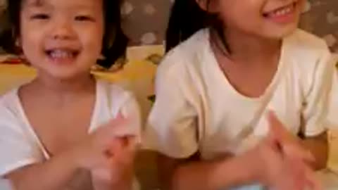 Children sing a happy birthday song Sing