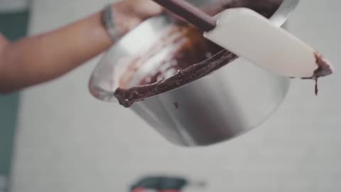 Putting A Chocolate Mixture On A Baking Tray