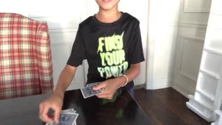 Kids does card magic trick
