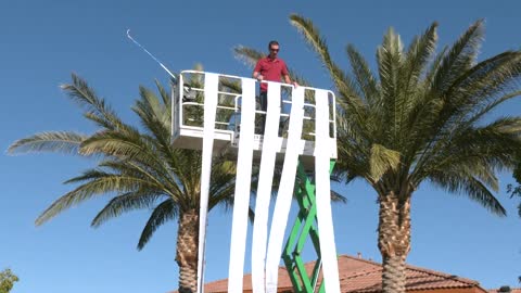 Man uses a Scissor Lift to compare different kinds of life insurance