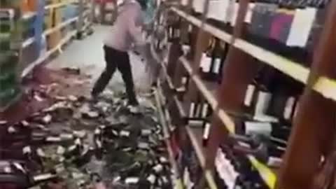 Argentine supermarket worker smashes hundreds of bottles of red wine after being fired