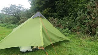 Opening the tent . Riverside wildcamping. Dartmoor