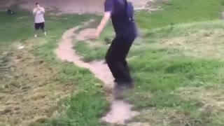 Guy skateboarding down hill falls down