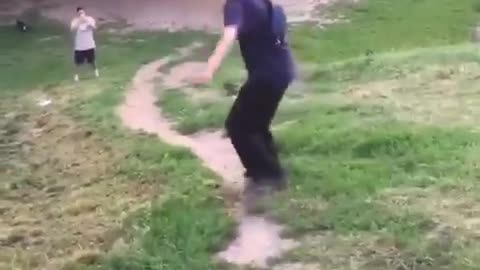 Guy skateboarding down hill falls down