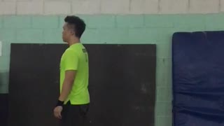 Guy neon green shirt backflip gymnastics fail