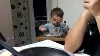 Kid Sneaks In Bite Of Food During Family Prayer