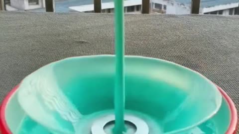 Captivating slow-motion footage of various objects falling through liquid