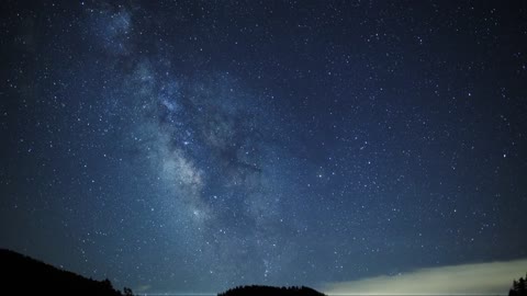 Looking at the beautiful starry sky on the sea in the evening.