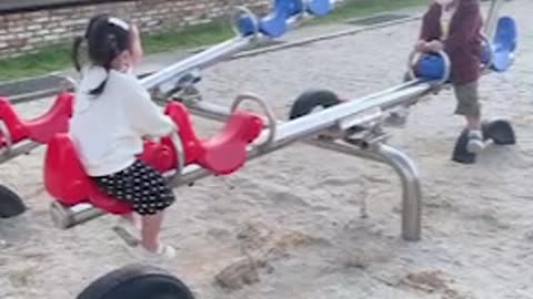 Seesaw riding babies