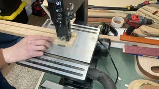 Cutting out a guitar neck.