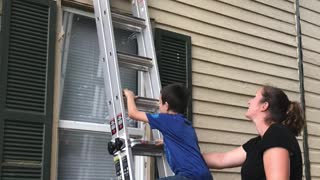 Boy climbs into window after locking door