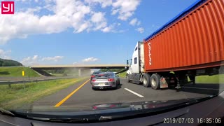 Semi Nearly Smashes into Silver Sports Car