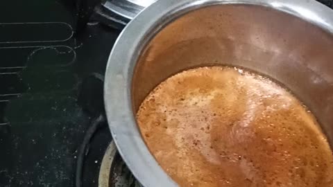 Pouring Indian Tea into a cup