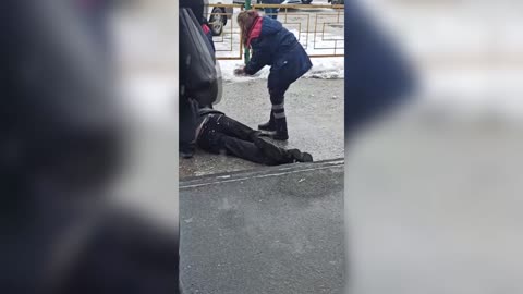 Paramedics Drag Drunk Man Along Asphalt To Ambulance