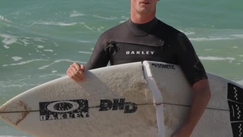 Surfer Stumbles and Snaps Board