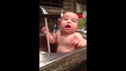 Bathing Baby Continually Startled By Running Faucet