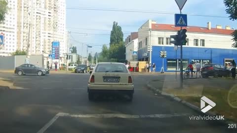 Car smashes curb on busy street