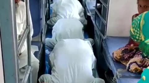 Muslims praying inside train