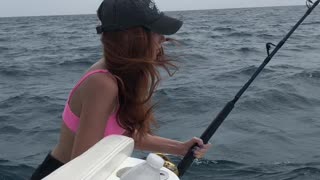 Catching a barracuda while fishing