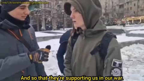 Ukrainian Nazi youth in Kiev with White Supremacist symbols on his jacket supports Israel