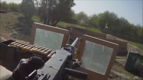 During an ambush, a 50 Cal gunner engages Taliban positions.
