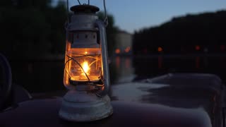 Oil Lantern at Night On Water Scenic
