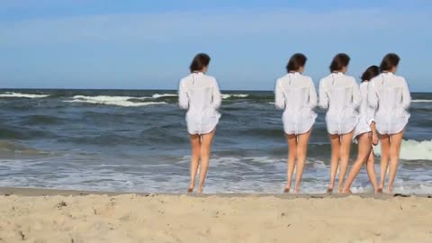 A trail Girl At The Beach Walking Through Sea Water