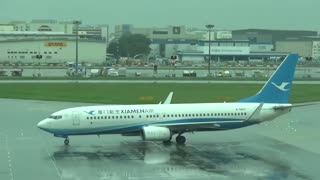 Boeing 737-800 B-5827 taxiing after landing in Singapore International Airport